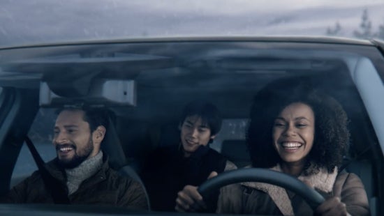 Three passengers riding in a vehicle and smiling | Passport Nissan Alexandria in Alexandria VA